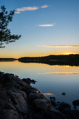 Beautiful evening coastal view and reflection in the sea, Korpo island, Finland