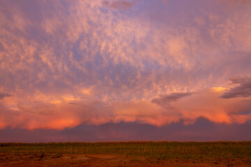 Sunrise after a rainstorm in Kazakhstan steppe.