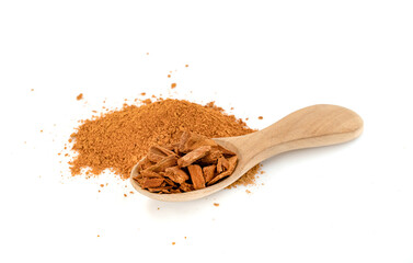 cinnamon sticks and powder with wooden spoon isolated on white background