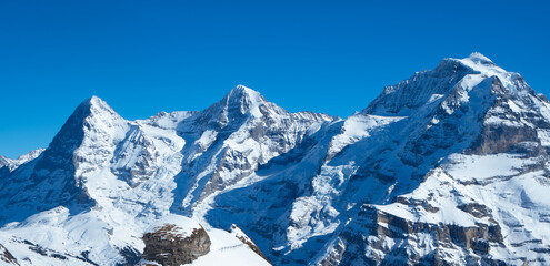 View from the ski region Muerren, to the famous ridge Jungfrau, Moench, Eiger - obrazy, fototapety, plakaty