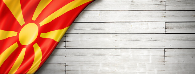 Macedonian flag on old white wall banner