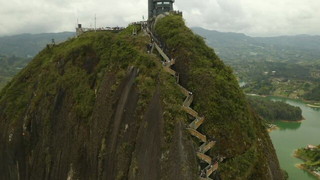 Close Up View of La Piedra del Penol, Guatape's Famous Rock. Aerial Pedestal Down