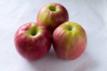 three apples with white background