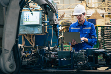 worker with robot in factory