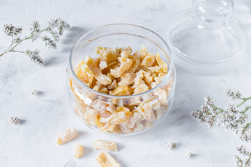 Homemade dried candied zucchini on a light background.
