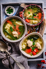 vegetable soup with meatballs and dumplings.style rustic