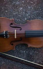 Obraz premium Violin put on background,show detail of acoustic instrument,
