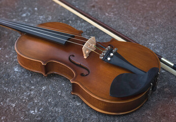 Fototapeta na wymiar Violin put on background,show detail of acoustic instrument,
