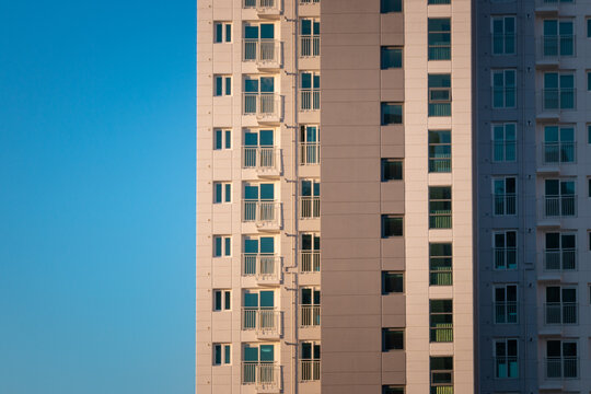 Part Of An Apartment Tower Against Blue Sky