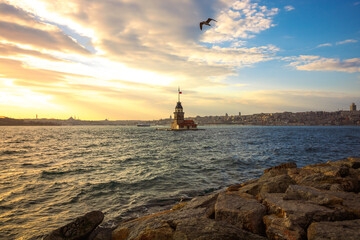 Fototapeta na wymiar Maiden's Tower at sunset with cloudy sky. Kiz Kulesi in Istanbul. cityscape of Istanbul at sunset. Istanbul background photo. Travel to Istanbul. 