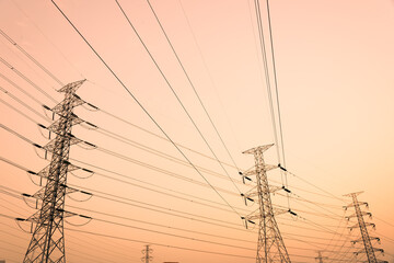 silhouette high voltage pole on sky sunset background.