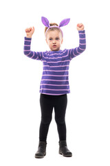 Cute little girl with easter bunny ears raising hands as success or victory gesture.  Full body isolated on white background. 