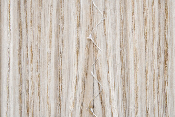 Oak texture as background. Spliced oak veneer with glue thread for furniture manufacturing closeup