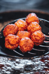 Frying home made italian traditional meatballs