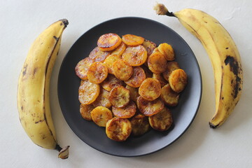 Caramelised plantain slices. A traditional tea time snack from Kerala.Cut ripe plantain into slices and toast it in a pan adding ghee n some brown sugar. © Trending Now