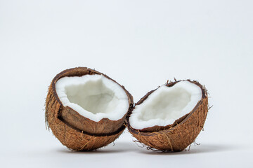 Isolated coconut on a white background. Two halves of a coconut. Healthy food