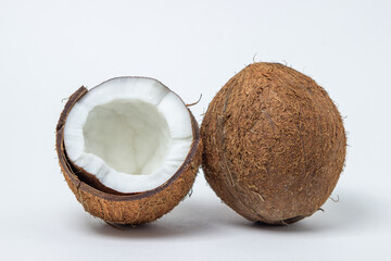 Isolated coconut on a white background. Whole and split coconut. Healthy food