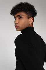 Obraz premium curly young african american man with piercing isolated on grey