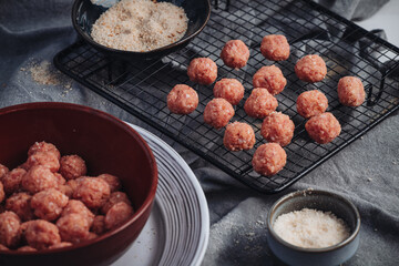 Raw home made Italian traditional meatballs