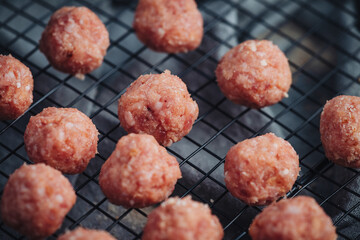 Raw home made Italian traditional meatballs