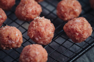 Raw home made Italian traditional meatballs