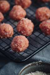 Raw home made Italian traditional meatballs