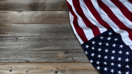 Fototapeta na wymiar Large cloth American flag on vintage wooden planks