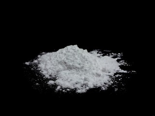 Obraz na płótnie Canvas Cocaine drug powder pile on black background