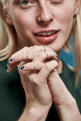 Selective focus on manicured hands with rings of man