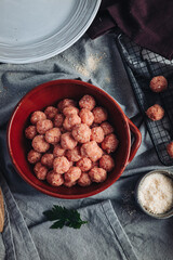 Raw home made Italian traditional meatballs