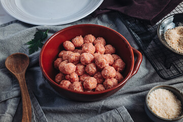 Raw home made Italian traditional meatballs