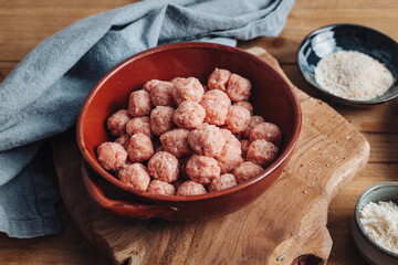 Raw home made Italian traditional meatballs