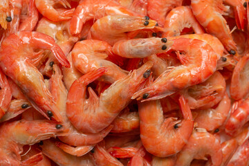 Shrimps background texture. A lot of shrimps. Cooked shrimps.