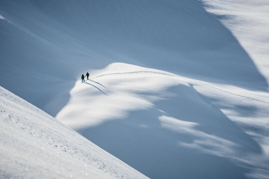 Two people skiing in the Alps, Lienz, Austria