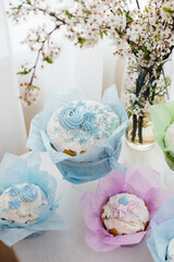 Beautiful Easter cakes on a decorated light table. A light holiday of Easter.