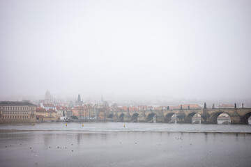 Charles bridge old town Prague hidden in the mist