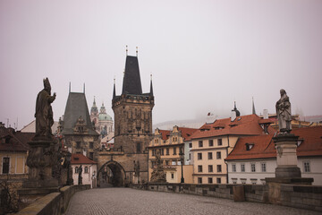Fototapeta na wymiar Charles bridge old town Prague hidden in the mist