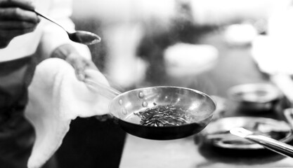 Chef cooking in a kitchen, chef at work, Black and White.