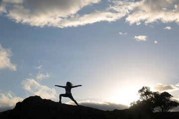 outdoors yoga meditation silhouette in the sky
