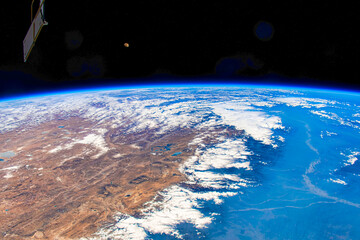 Clouds over the coast of India. Digital Enhancement. Elements of this image furnished by NASA