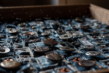 A Blue Denim Fabric. Buttons and labels for denim pants