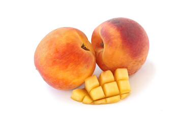 Two peaches and the cut part isolated on white