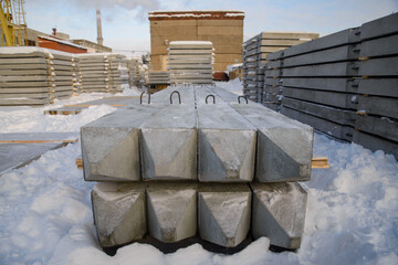 Close-up of the front end of the reinforced concrete piles driving the piles into the ground