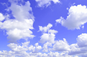 Air white clouds against the blue sky. Texture. The background of nature.