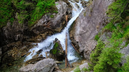 mountain waterfall flowing on the rocks
