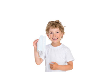 Smiling boy with protective medical mask removed