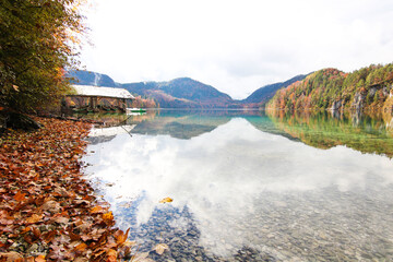 sea with boatshouse in autumn