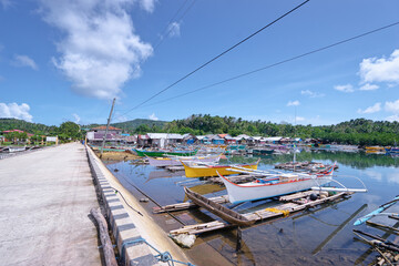 Landscape with pier and fishing boats. Siargao, Philippines.