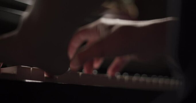 Close up of finger musician at the piano , The pianist playing  piano in the room ,classic piano.hobby