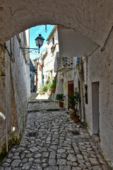 Fototapeta na wymiar A narrow street in the medieval town of Pietramelara, in the province of Caserta, Italy.